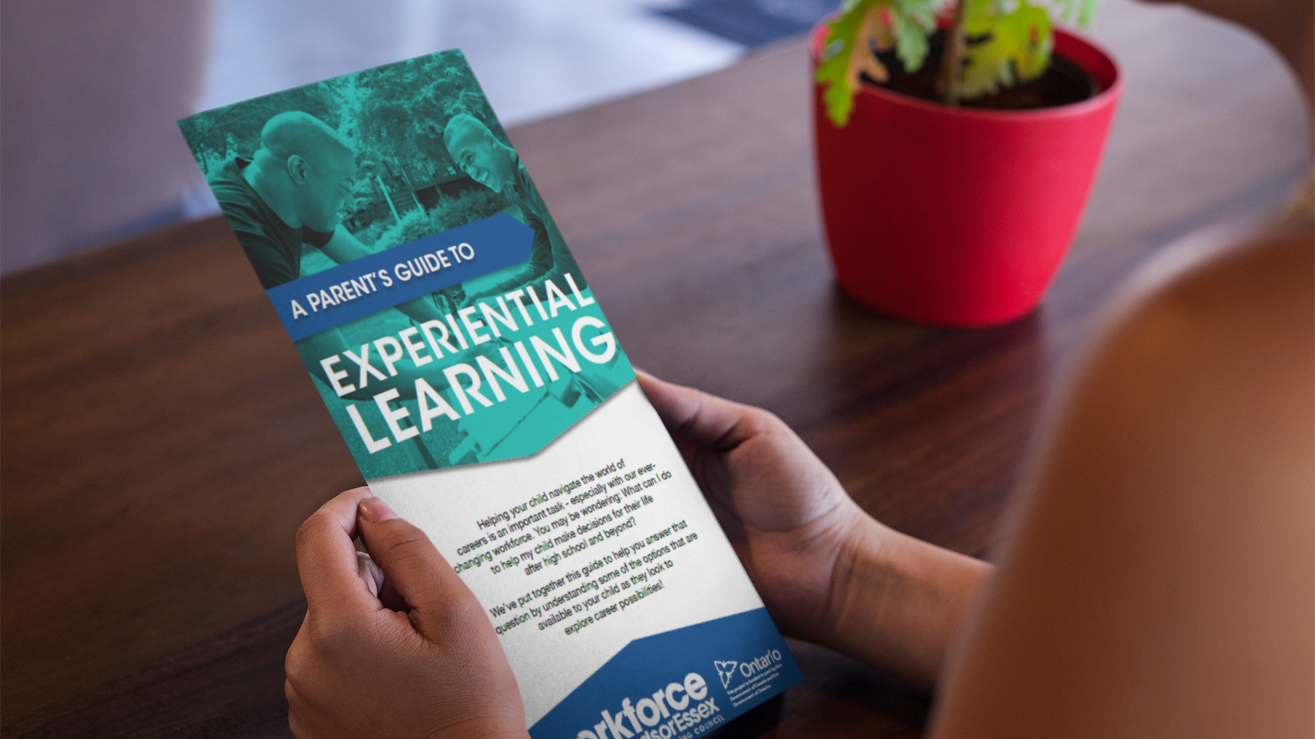 Person holding A Parent's Guide to Experiential Learning