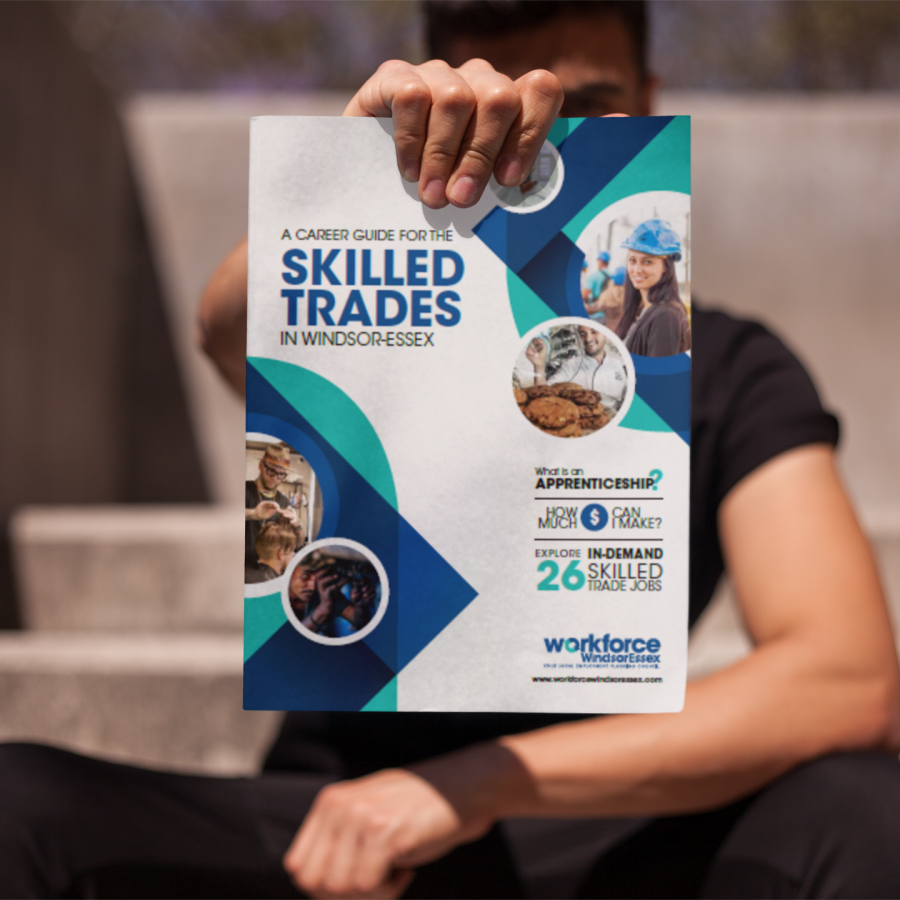 Person holding A Career Guide for the Skilled Trades in Windsor-Essex
