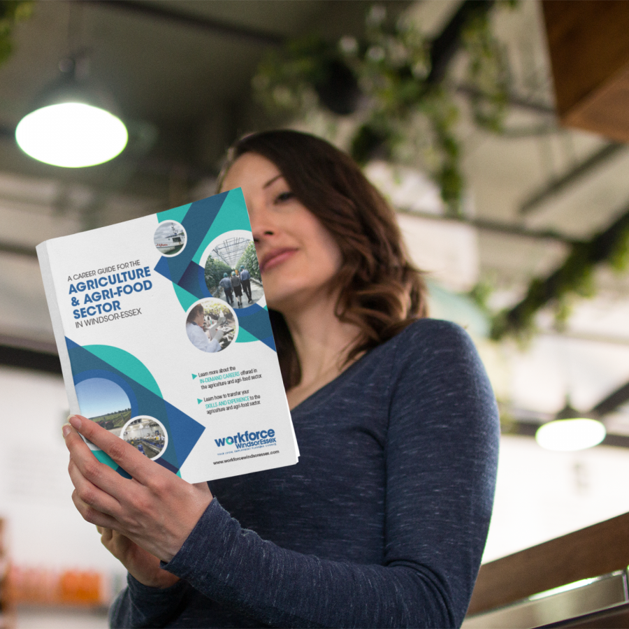 Woman reading Workforce WindsorEssex Agriculture Career Guide