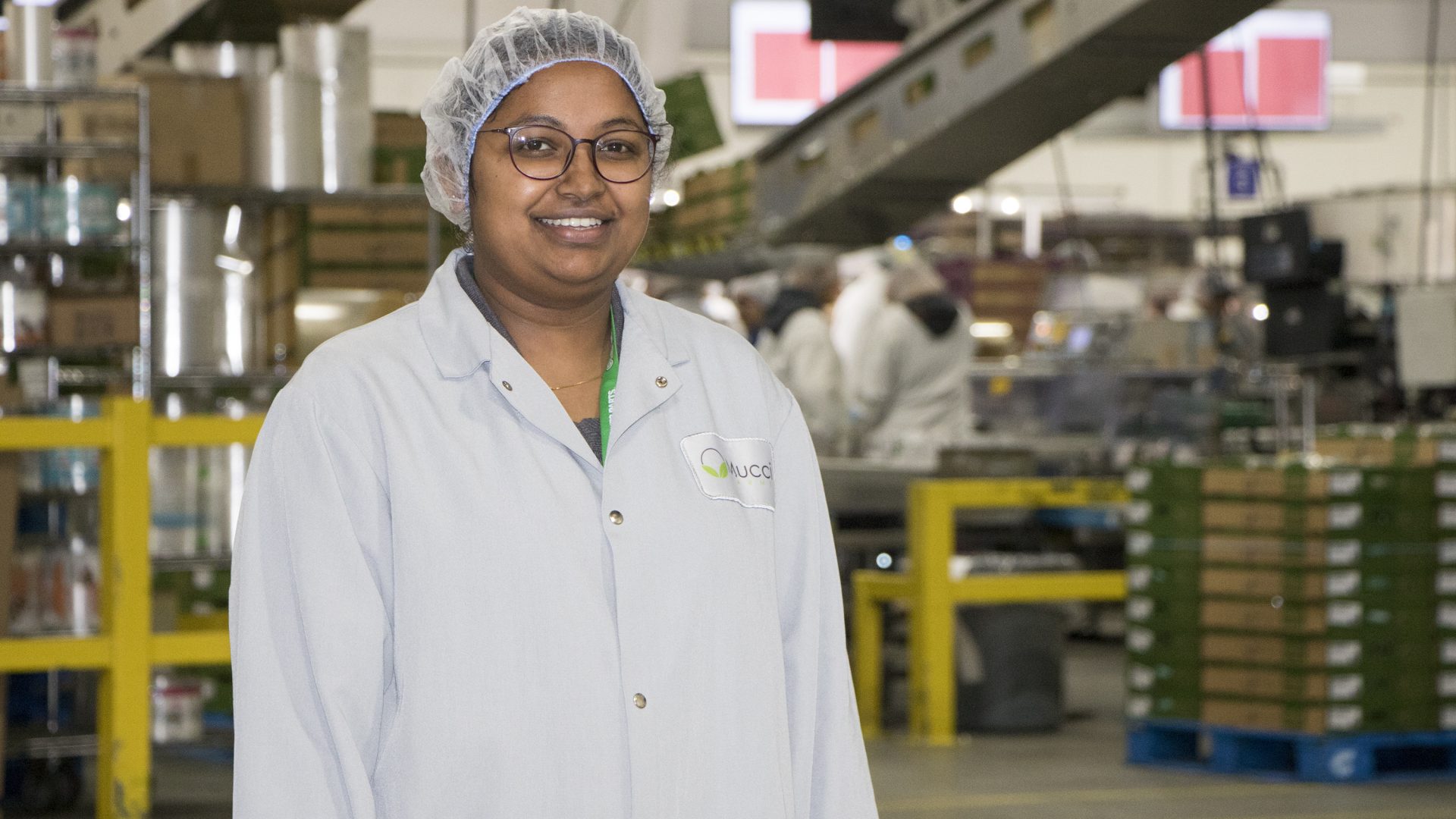 Woman working inside agriculture facility