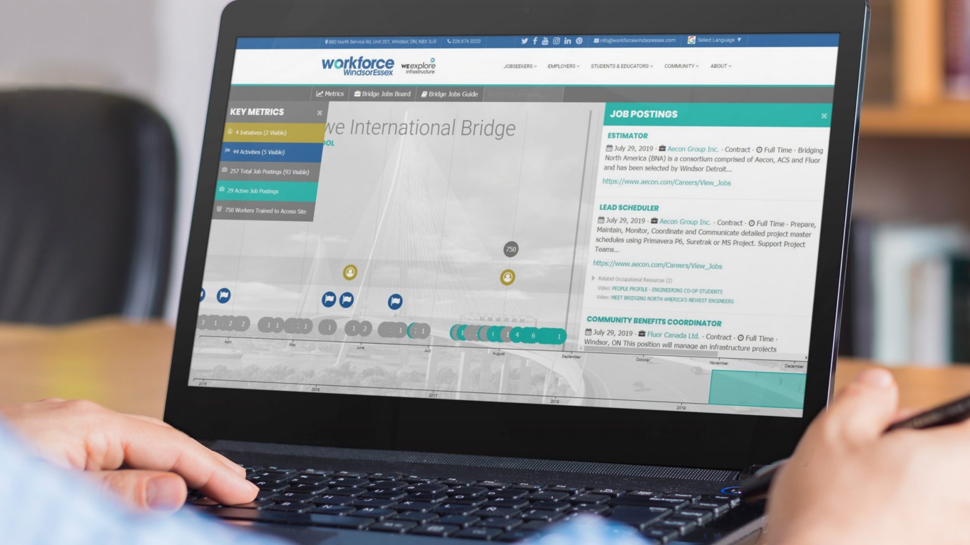 Gordie Howe International Bridge Workforce Timeline Tool on laptop